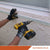 Person using a drill to install trim on a concrete wall with a concrete screw