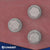 three hex bolts and fender washers installed on a red metal exterior surface
