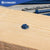 Concrete screw installed into wood block and concrete.