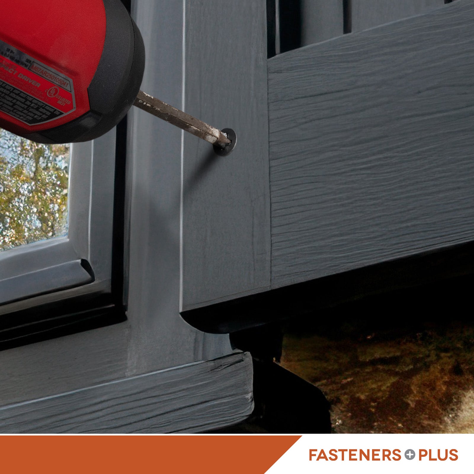 Black concrete screw drilled into residential siding