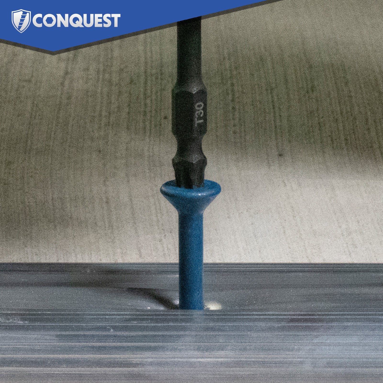 Blue concrete screw being driven into a concrete surface with 'Conquest' branding.