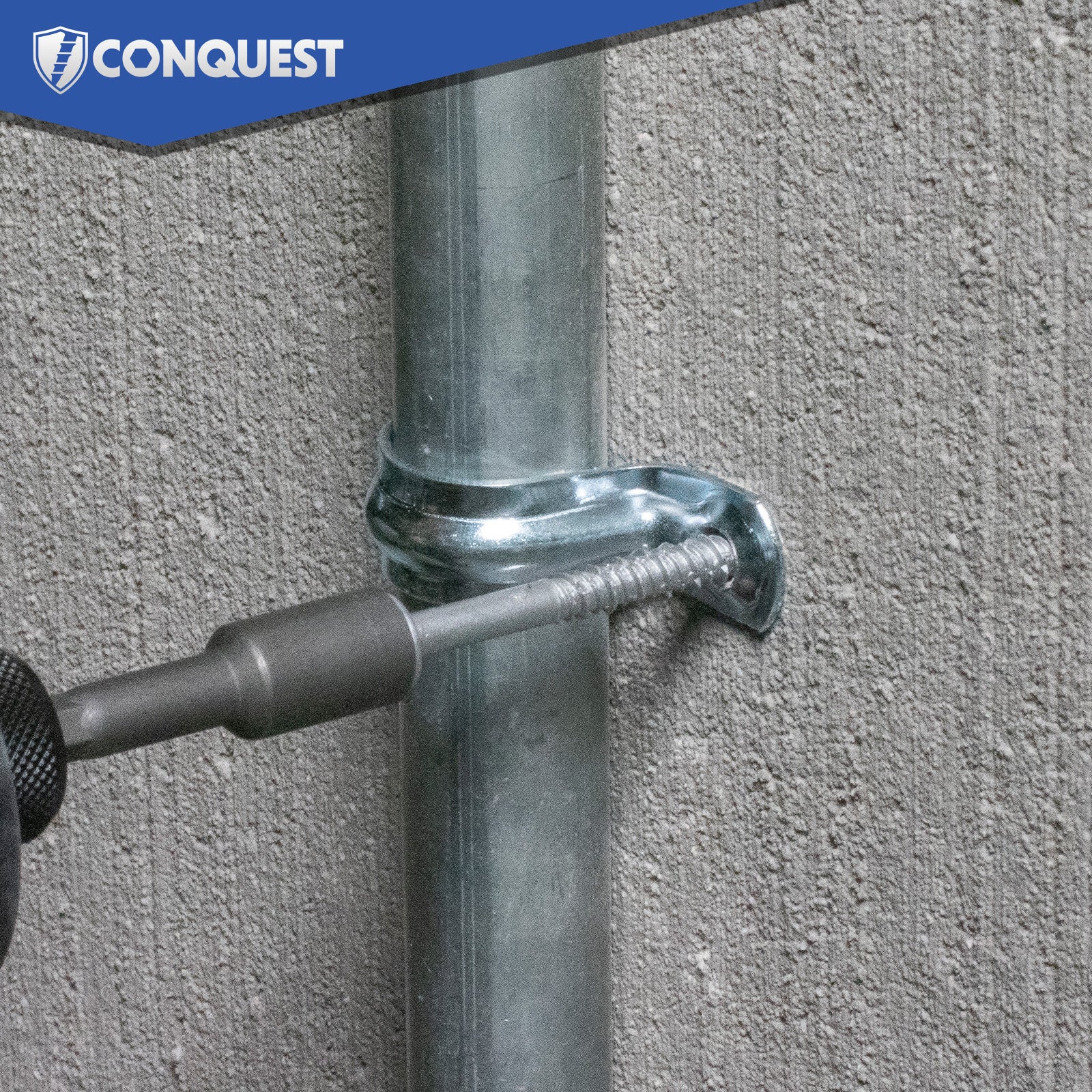Metal pipe being secured to a concrete wall with a tool, featuring the Conquest brand logo.