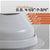 Gray pipe fitting with measurement chart on a white background