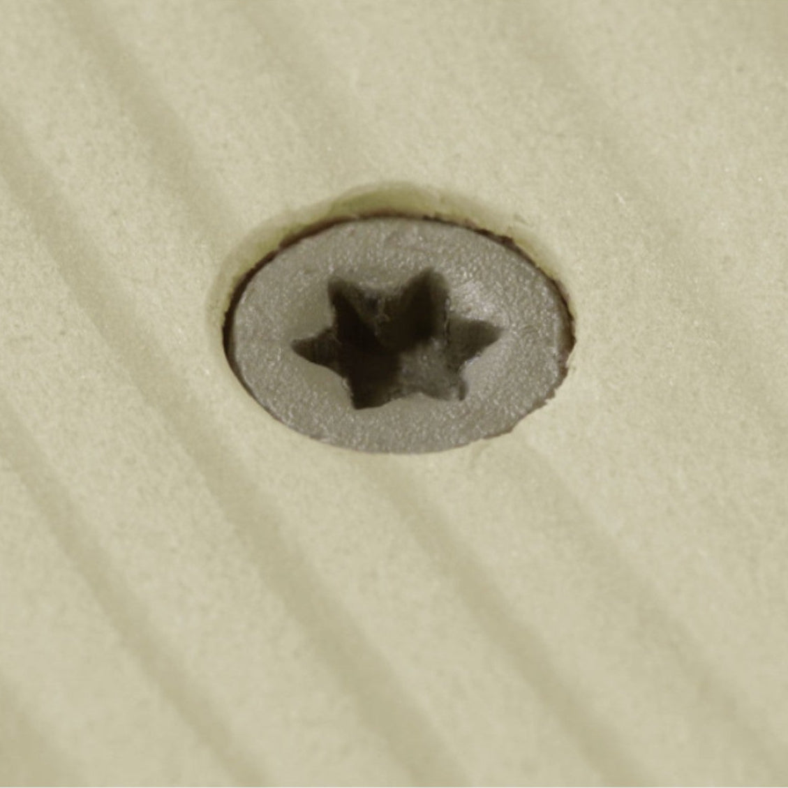 Close-up of a screw in wood
