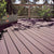 Composite deck with potted plants and a railing in the background