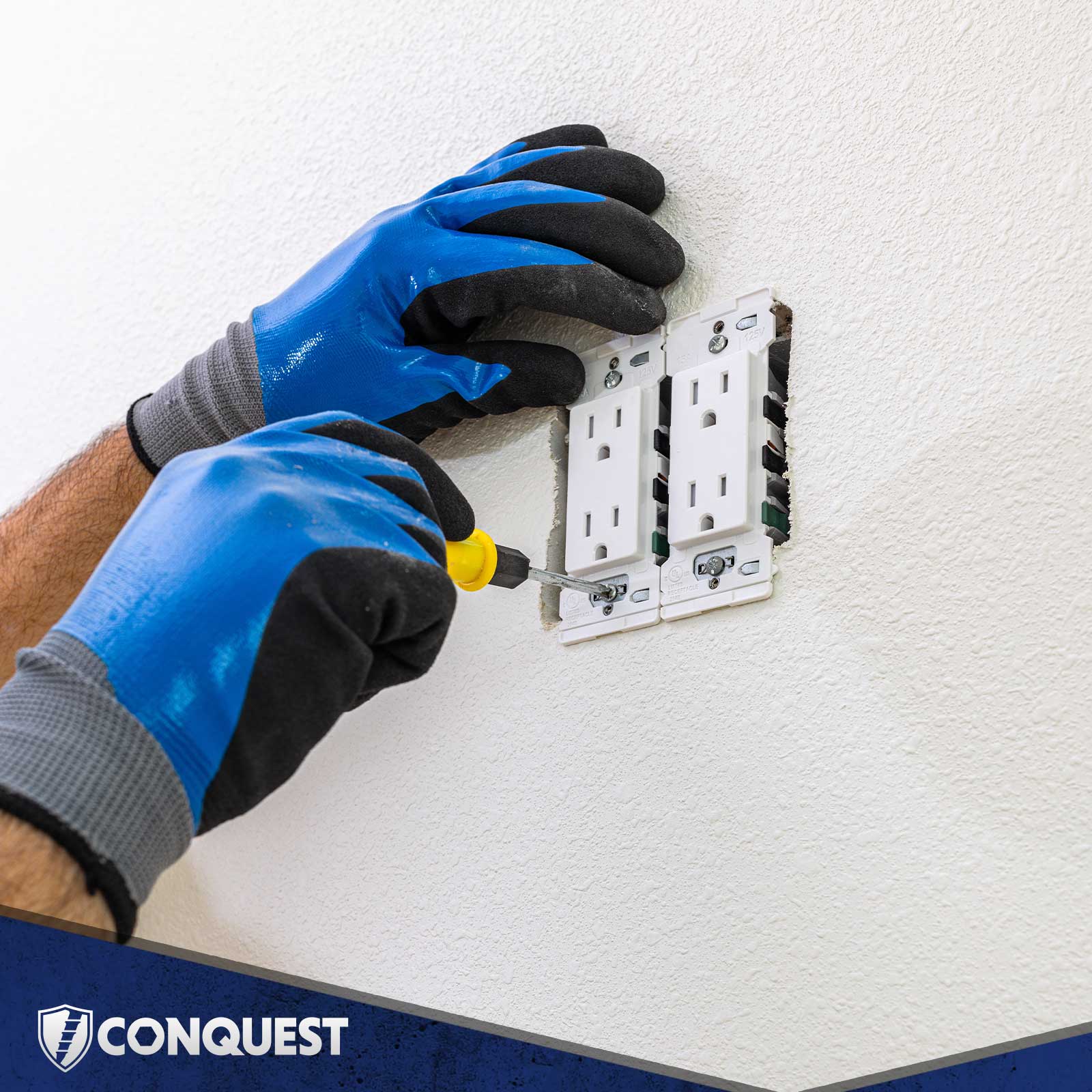 Person installing electrical switches on a wall with machine screws