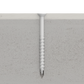 Screw being driven into concrete with a close-up view of the screw and concrete surface.