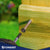 Screw being driven into a yellow wooden surface with 'Conquest' branding visible.