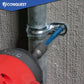 Drill screwing in blue concrete screw on a metal pipe with 'Conquest' branding in the corner.