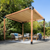 Wooden pergola with outdoor furniture under a clear blue sky