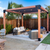 Outdoor patio with pergola, seating area, and fire pit in a backyard setting.
