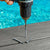 Drill with deck drive scrrews on a composite deck near a pool