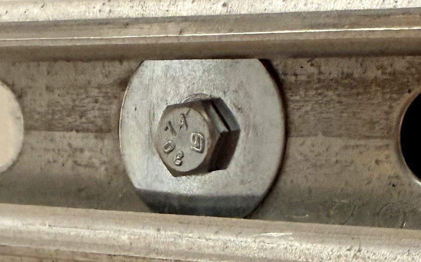 Close-up of a metal hex bolt and fender washer