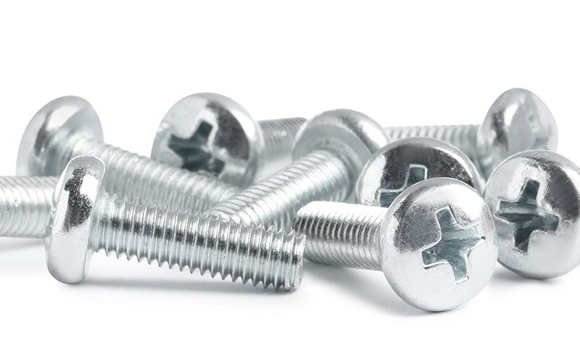 Close-up of machine screws on a white background
