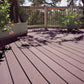 Composite deck with potted plants and a railing in the background
