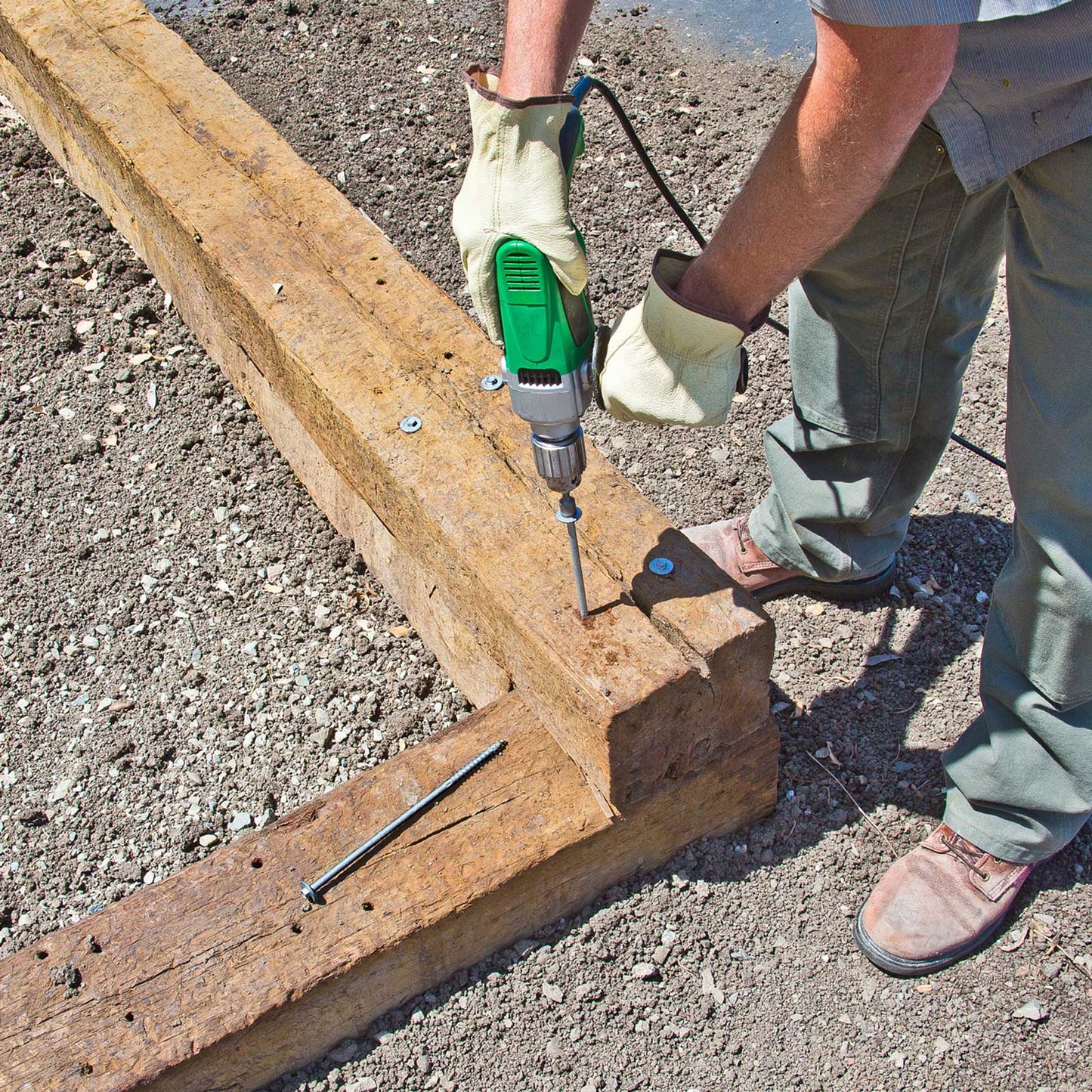 installing SDWH Timber Hex HDG Screws into railroad ties