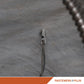 Tie wire wedge anchor installed in concrete