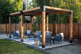 Completed Simpson Sage DIY Wooden Pergola with outdoor furniture on a patio area