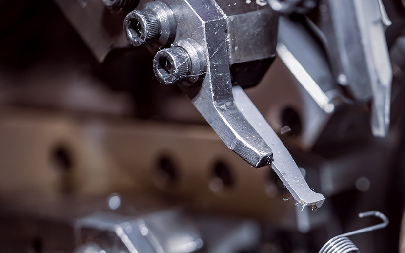 Close-up of a metal tool with shoulder screws