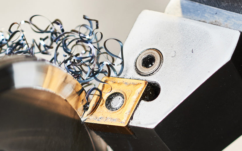 Close-up of a metal shavings and a shoulder screw