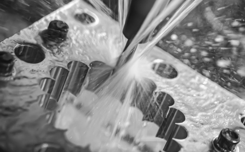 Metallic object with liquid being poured over it
